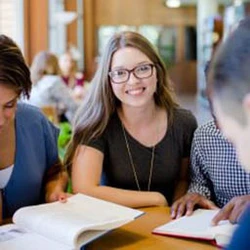 Students at desk with papers