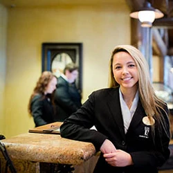 Student at hotel registration desk