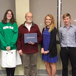 Math professor posing with students