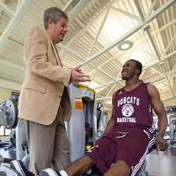 Trainer and students in fitness center